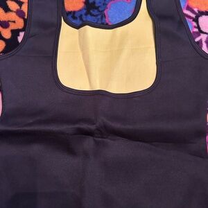 Black and Yellow tank top that helps one lose inches will working out